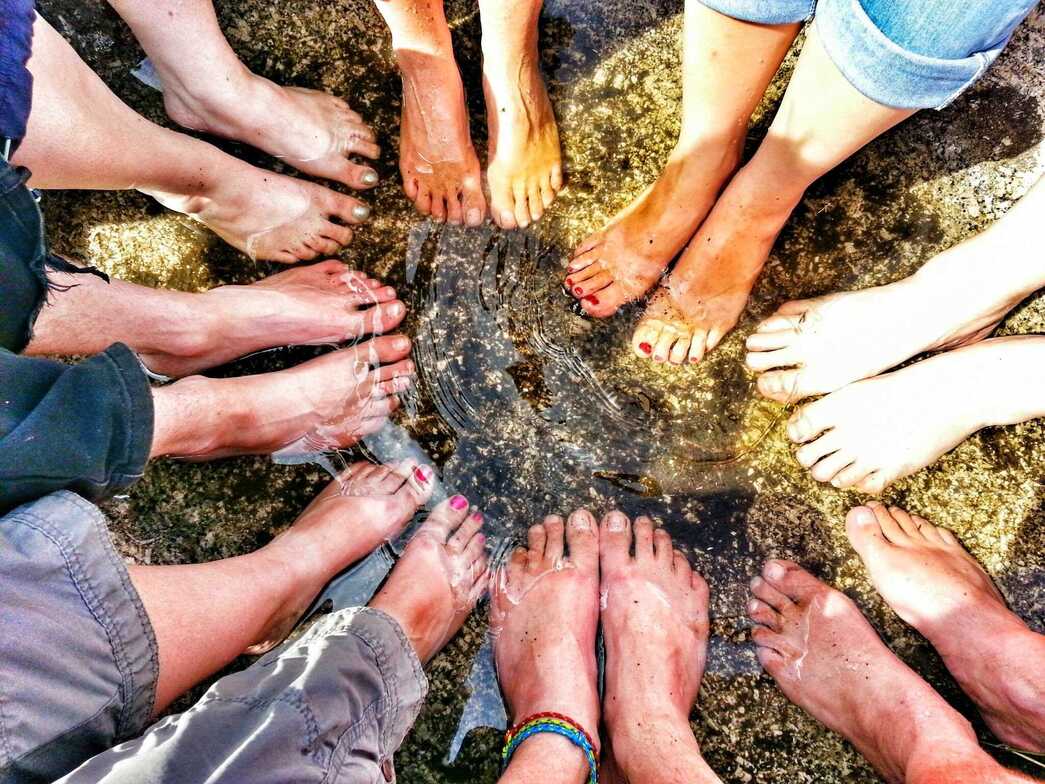 Bare feet in rock pool